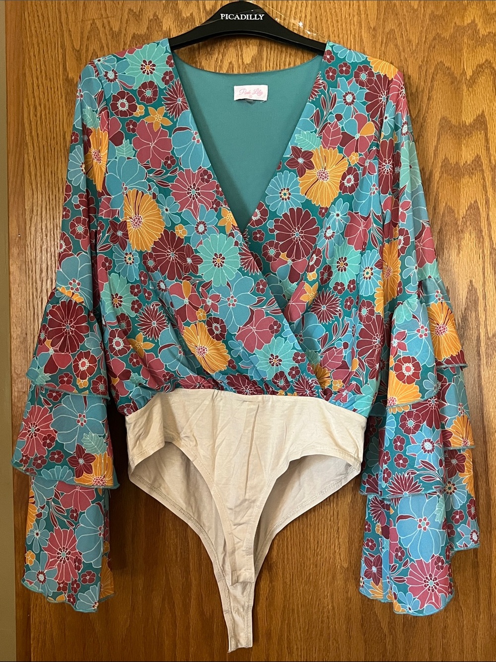 Pink Lily Turquoise Floral Wrap Bodysuit with Yellow & Burgundy Flowers